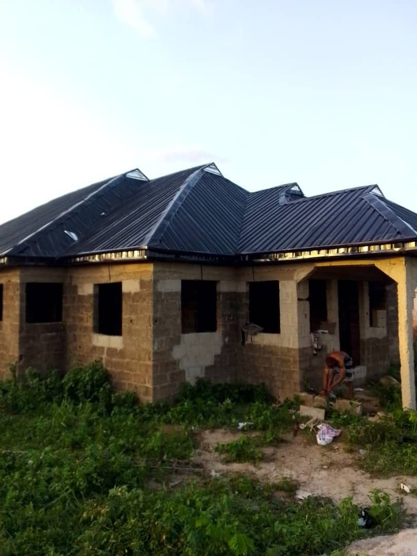 Bungalow with completed aluminium roofing by Gods Promise Aluminium