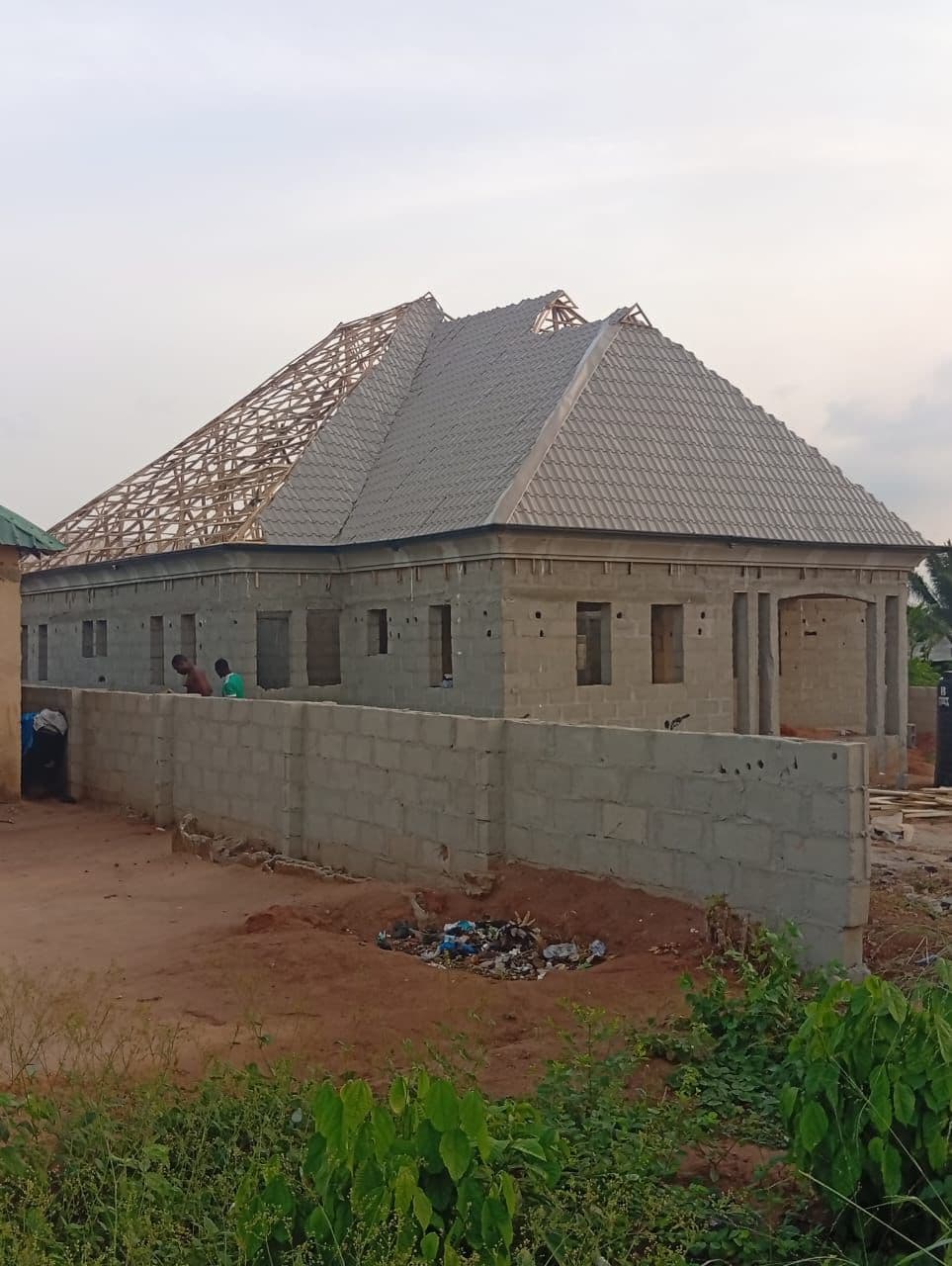 Roof installation in progress on a residential building