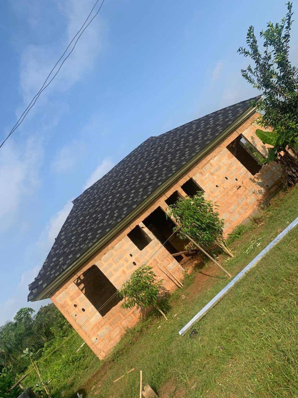 Different types of aluminium and stone-coated roofing sheets at Gods Promise Aluminium.