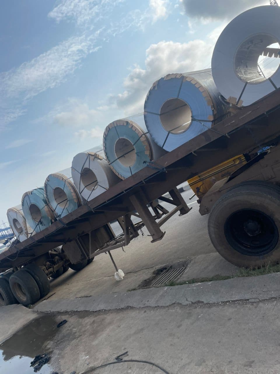 Aluminium flatsheet coils loaded for delivery — roofing price trend Nigeria 2024 to 2026