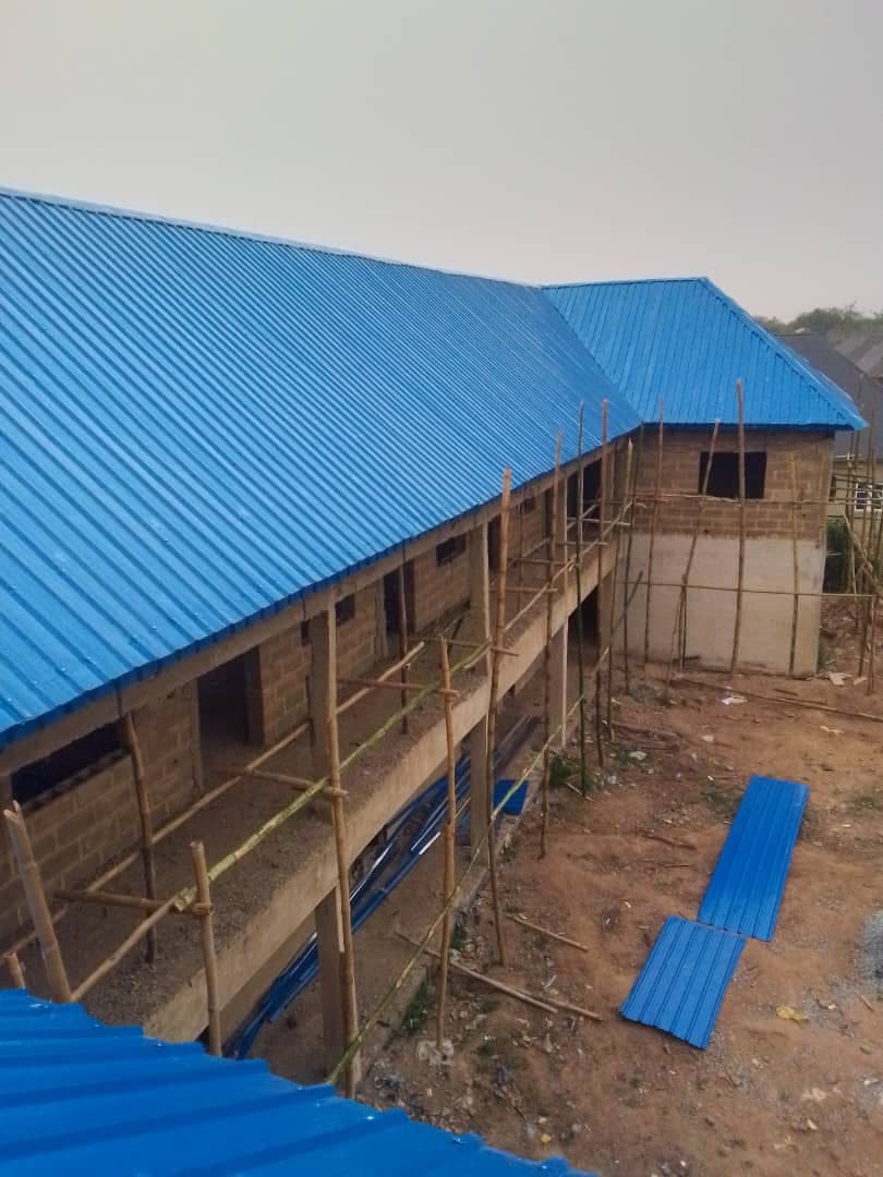 Roof view of a freshly roofed building — aluminum roofing sheet price per square metre Nigeria 2026