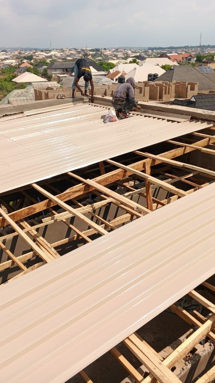 Flat roof aluminium sheet installation showing gauge thickness — 0.45mm vs 0.55mm price difference Nigeria
