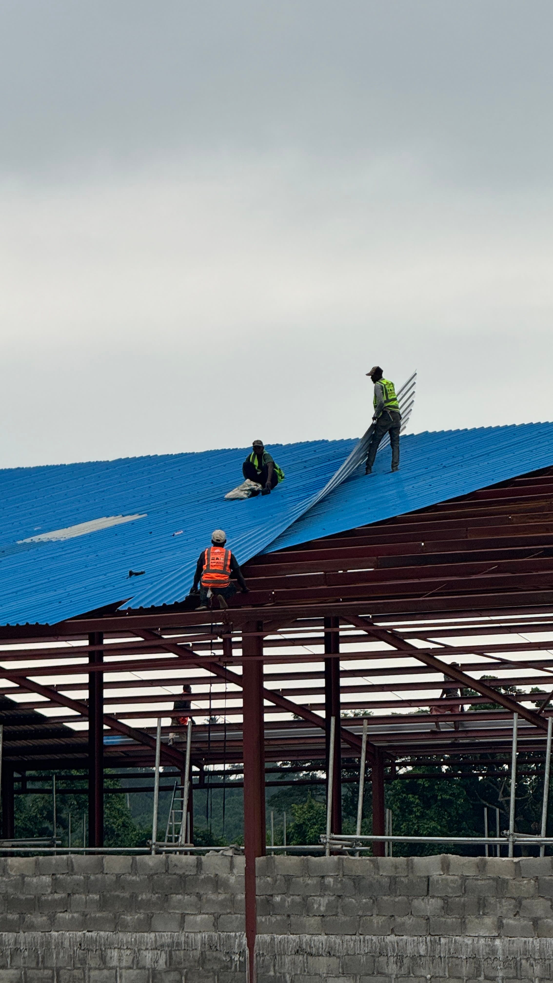 Our experienced team installing a high-quality aluminium roofing system for a residential property in Lagos, Nigeria.